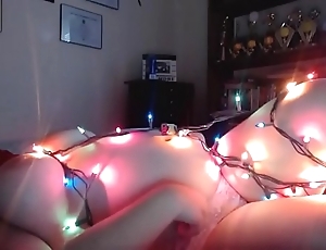 Fat woman hangs out in christmas lights