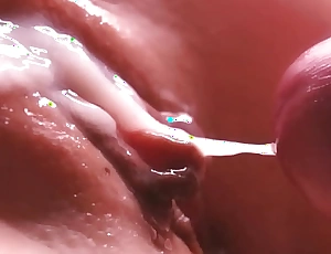 Capture motion cum between her labia close-up