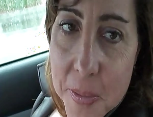Sexy milf is ergo horny she plays with the brush pussy in public