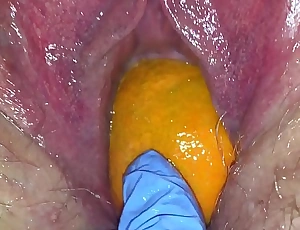 Stingy pussy milf gets her pussy destroyed with a orange and big apple popping it out of her Stingy hole diet her squirt